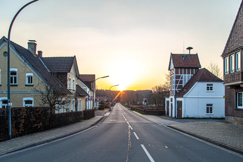 A quiet residential street of houses at sunset